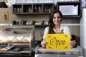 Small business: Happy owner Open